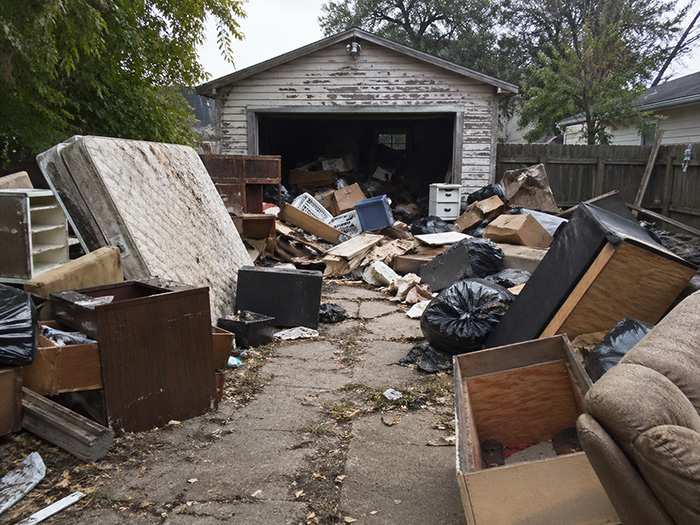 Before junk removal garage clutter